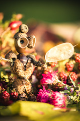 tinker colorful little figures in autumn time