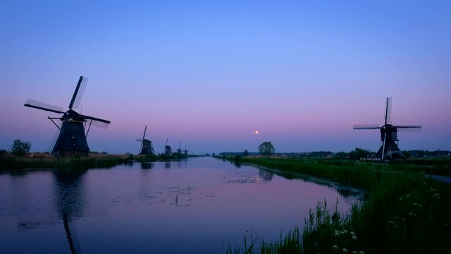 Windmills at Kinderdijk in Holland after sunset. Netherlands