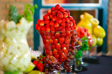 Several strawberries in glass bowl