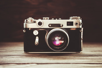 retro camera on wooden background, retro style image