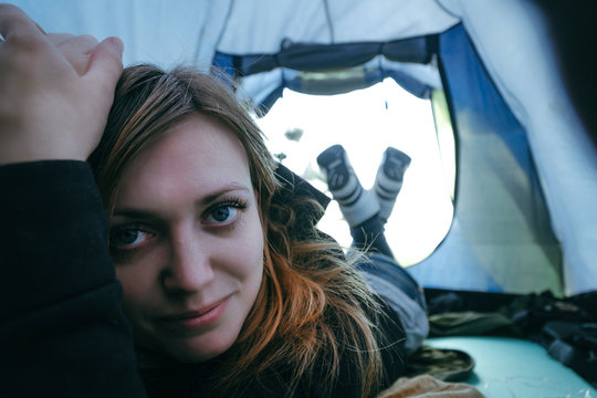 View From Inside A Tent At The Mountain And Close Up Portrait Smile Woman, Girl. Travel And Hiking Road Trip Concept. Tourist Tent Outside