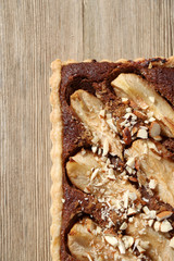 Tart with pear and almond filling and decoration. Top view, close-up.
