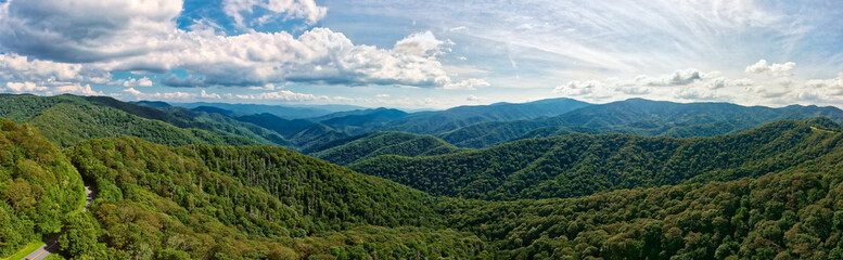 Naklejka na ściany i meble Aerial Panorama of green mountains