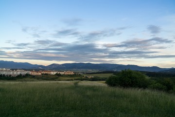 Fototapeta premium Sunrise and sunset over the hills and town. Slovakia