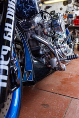 Fototapeta na wymiar Detail on a modern motorcycle in the workshope. Motorcycle Exhaust. selective focus
