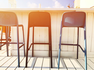 Vacant seats at the open-air bar on the roof