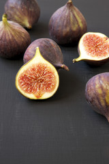 Fresh figs on dark table, side view. Closeup.