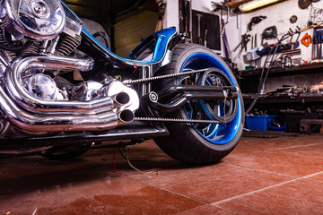 Detail on a modern motorcycle in the workshope. Motorcycle Exhaust. selective focus