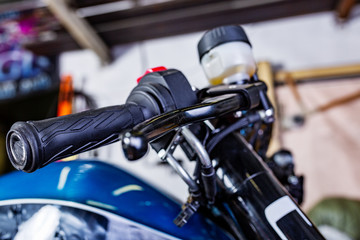 Fototapeta na wymiar Detail on a modern motorcycle in the workshope. Motorcycle Exhaust. selective focus