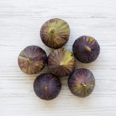 Fresh figs on white wooden background, top view. From above, overhead.