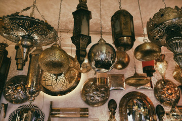 Moroccan traditional lamps and lanterns on display in the souk shop in the center of medina in...