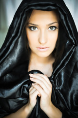 Naklejka premium Beautiful young woman in prayer, nun