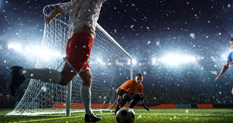 Intense soccer moment in front of the goal on the professional soccer stadium.