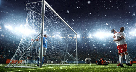 Intense soccer moment in front of the goal on the professional soccer stadium.