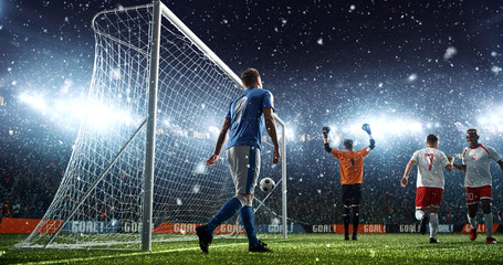 Intense soccer moment in front of the goal on the professional soccer stadium.