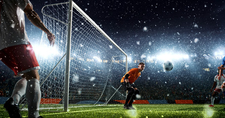 Intense soccer moment in front of the goal on the professional soccer stadium.