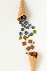 chocolate, blueberry in a waffle cone for ice cream