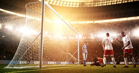Intense soccer moment in front of the goal on the professional soccer stadium.