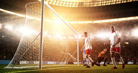 Intense soccer moment in front of the goal on the professional soccer stadium.