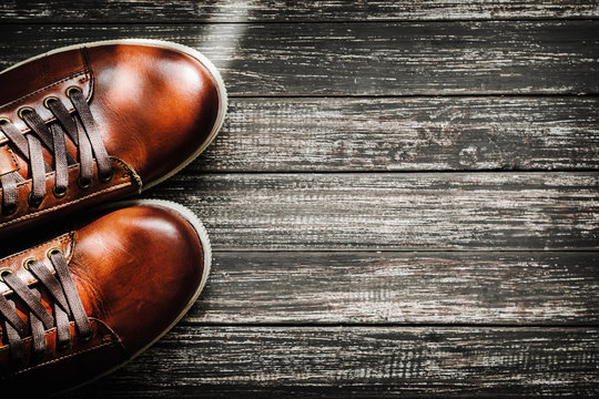 Brown Shoes On Wooden Background Top View With Copy Space