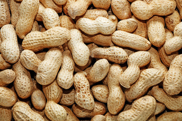 Peanuts in shells on the background of sack cloth.