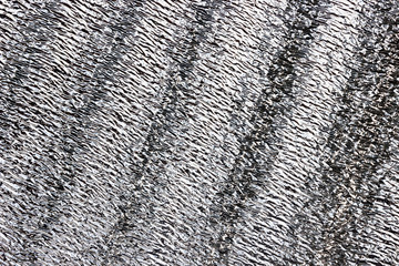 silver metallic finish with wavy pattern