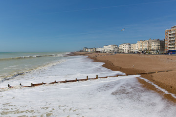White waves breaking on Worthing beach West Sussex 