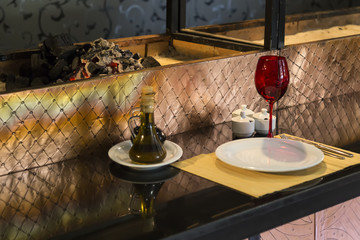 plate,glass,fork,knife and service napkins on the black background for restaurant and cafe concept.