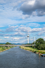 The view of Neckar river, the bridge and TV tower with hills in the background. Shot in Manheim on...