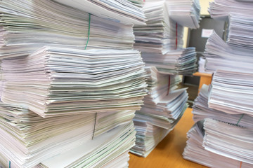 bundles bales of paper documents. stacks packs pile on the desk in the office