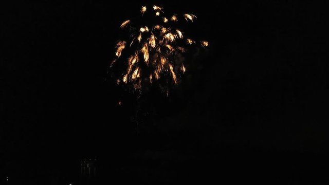Aerial footage of fireworks over water. Rhine, Hesse, Germany.