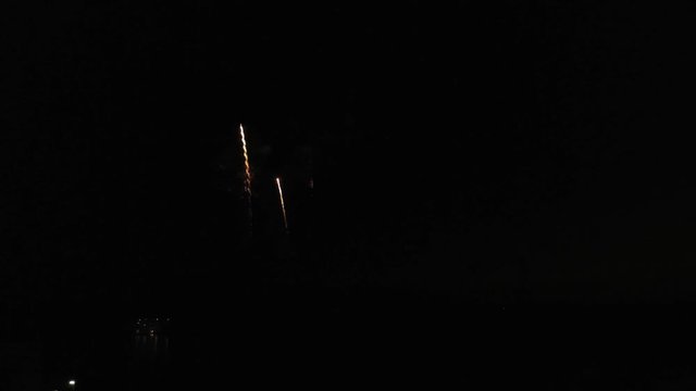 Aerial footage of fireworks over water. Rhine, Hesse, Germany.