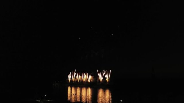 Aerial footage of fireworks over water. Rhine, Hesse, Germany.