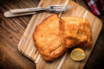 Two fried cod fillet pieces.