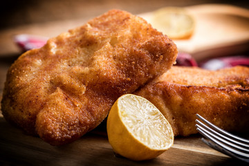 Two fried cod fillet pieces.