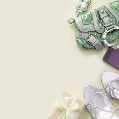 Modern fashion accessories young women shoes handbag phone gadget gift box yellow background.