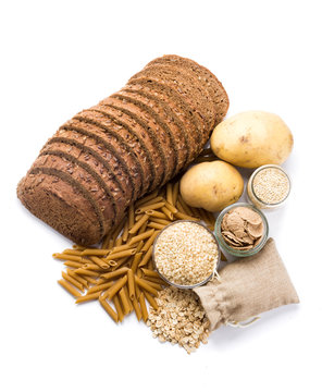 Group of whole foods, complex carbohydrates isolated on a white background