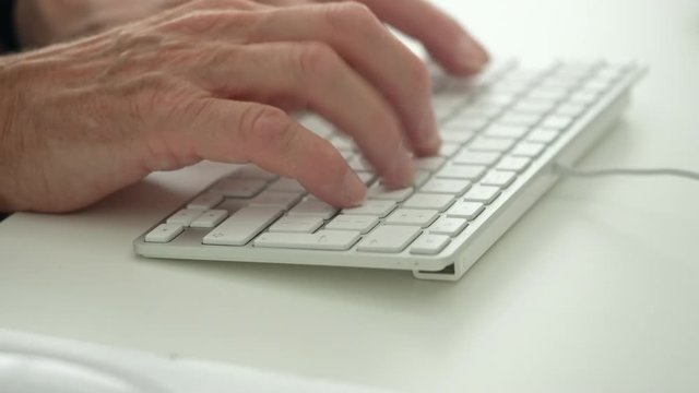 qwert typing on a computer keyboard.