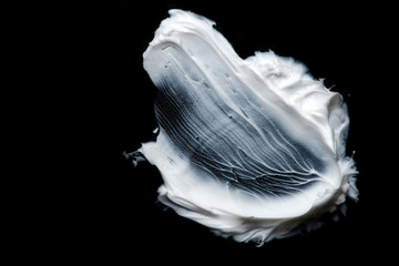 white cream on a black background