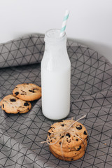 Delicious homemade chocolate crisp cookies and bottles of milk