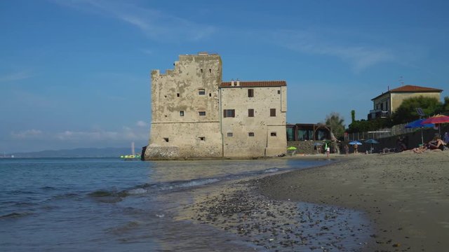 Torre Mozza, Piombino, Tuscany, Italy - 17 June 2018. View on the sea, beach and ancient fortress at morning light