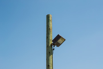 Street lamp wooden pole
