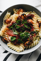 Delicious pasta with tomatoes, mussels and herbs