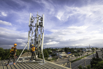 technician installing communication tool on high pole