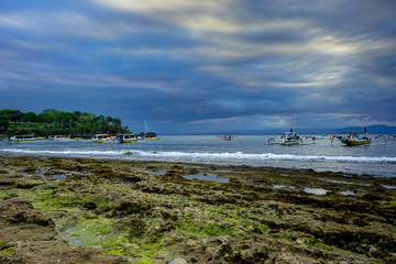 View towards ocean with ships boats Nusa Lembongan Indonesia