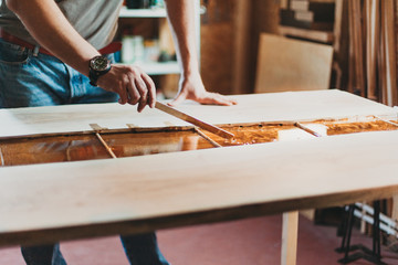 Detail of Carpenter Working in his Workshop with Epoxy Resin