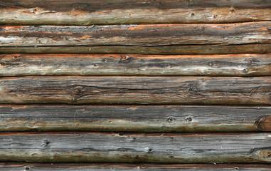 Wooden wall from logs old as background texture