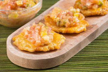 Patacón fried flattened pieces of green plantain (tostón, tachino)