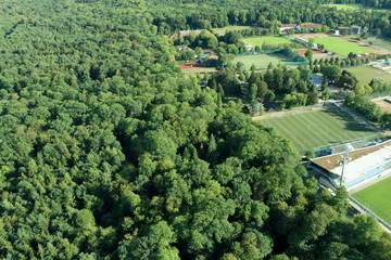 Amazing Landscape view on the beautiful forests, alpine mountains and idyllic fields of South Germany with a blue sky before sunset with clouds city view from the top