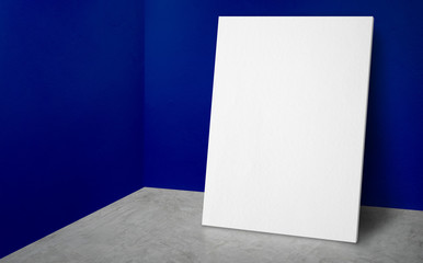 Blank poster at corner vivid blue wall and  concrete floor studio room with background,Mock up studio room for display or montage of product for advertising on media,Business presentation.